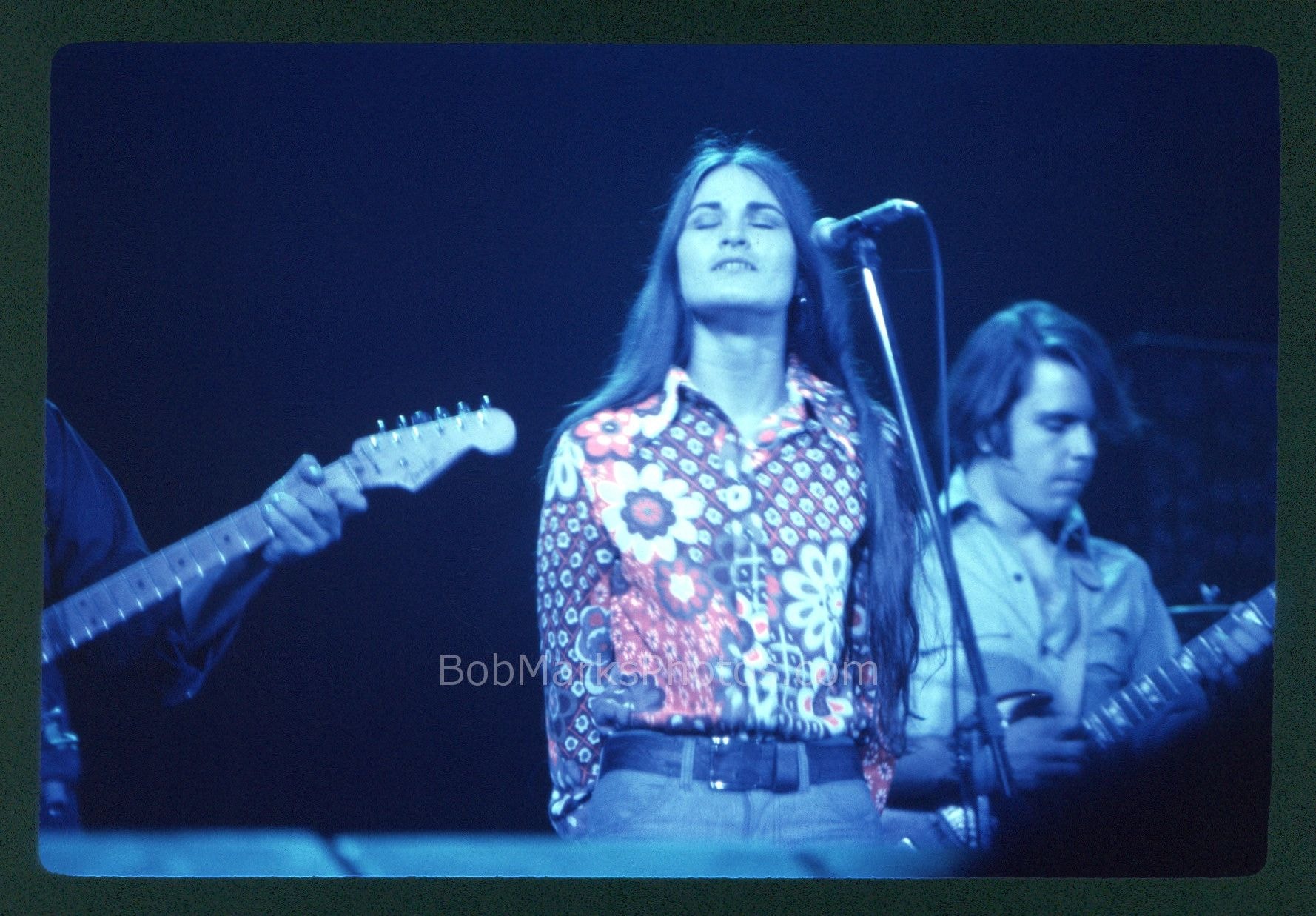 Singer and guitarists on stage