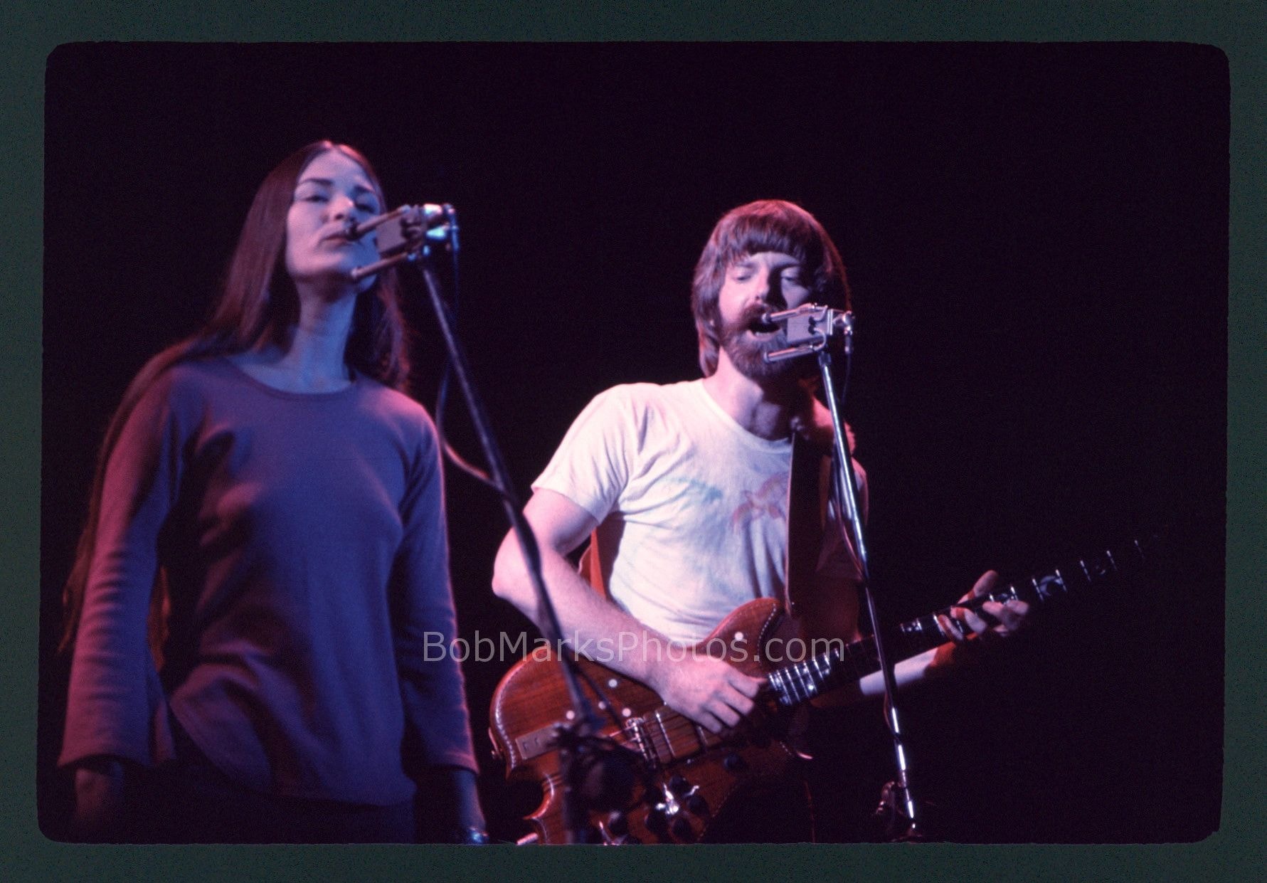 Two musicians performing on stage